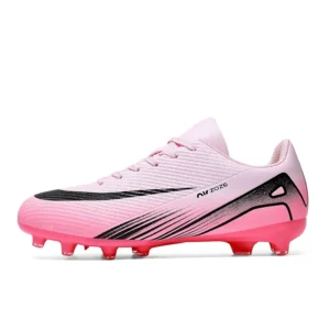 Low-top pink TF soccer cleats side view